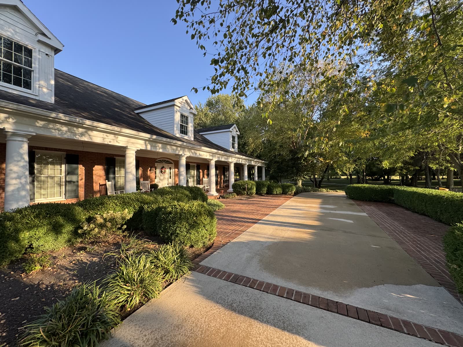 Ranch home with freshly cleaned concrete and brick driveway in Plain City, OH