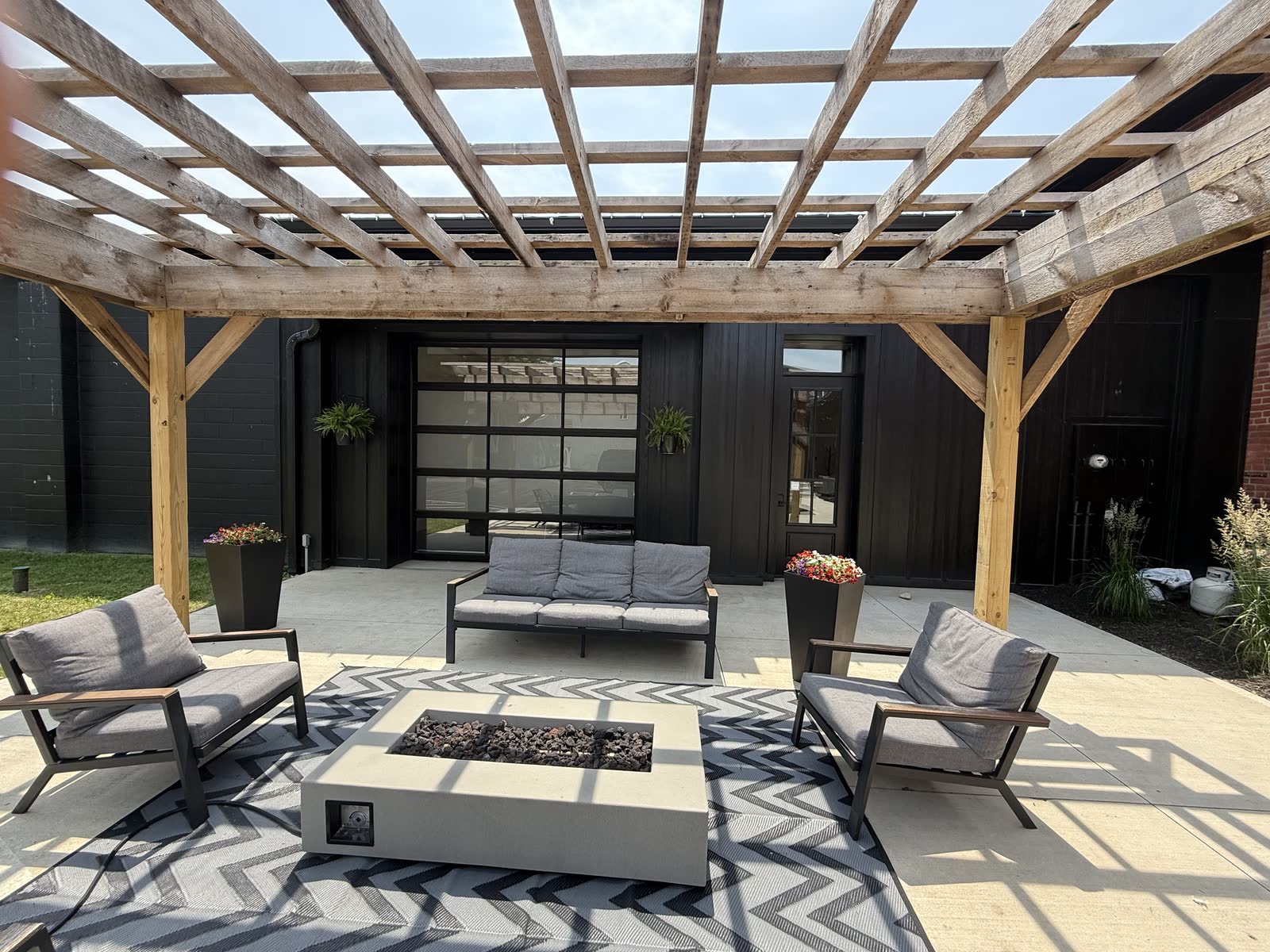 Restored paver patio with landscaping after pressure washing