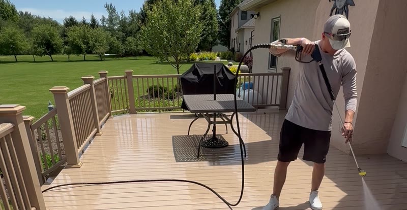 Mullet Power Wash technician pressure washing a composite deck at a Central Ohio home
